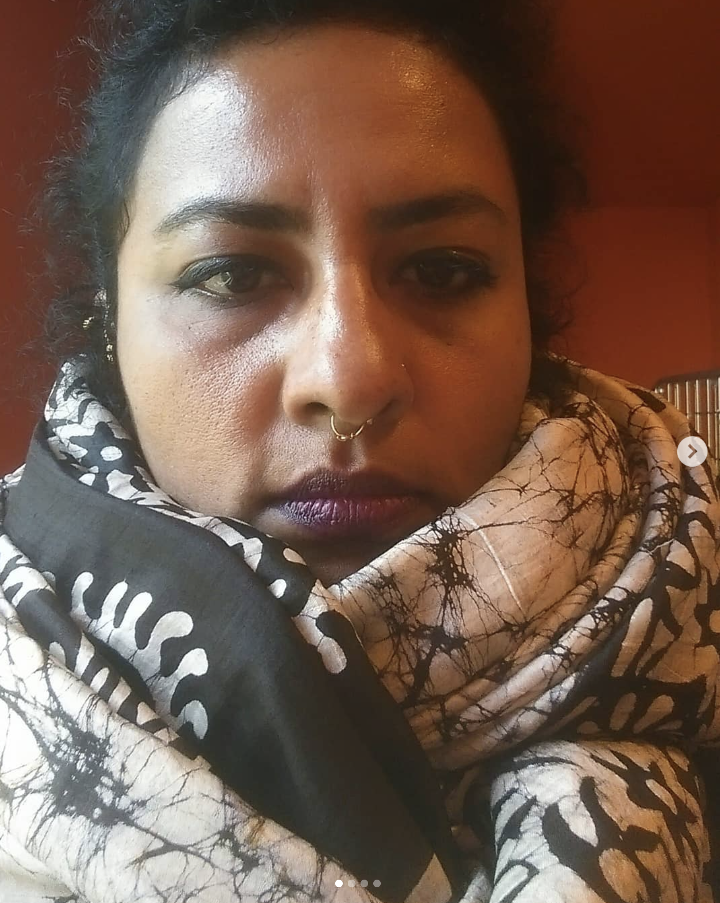 Close-up portrait of Vishnu Vardhani Rajan with a patterned scarf
